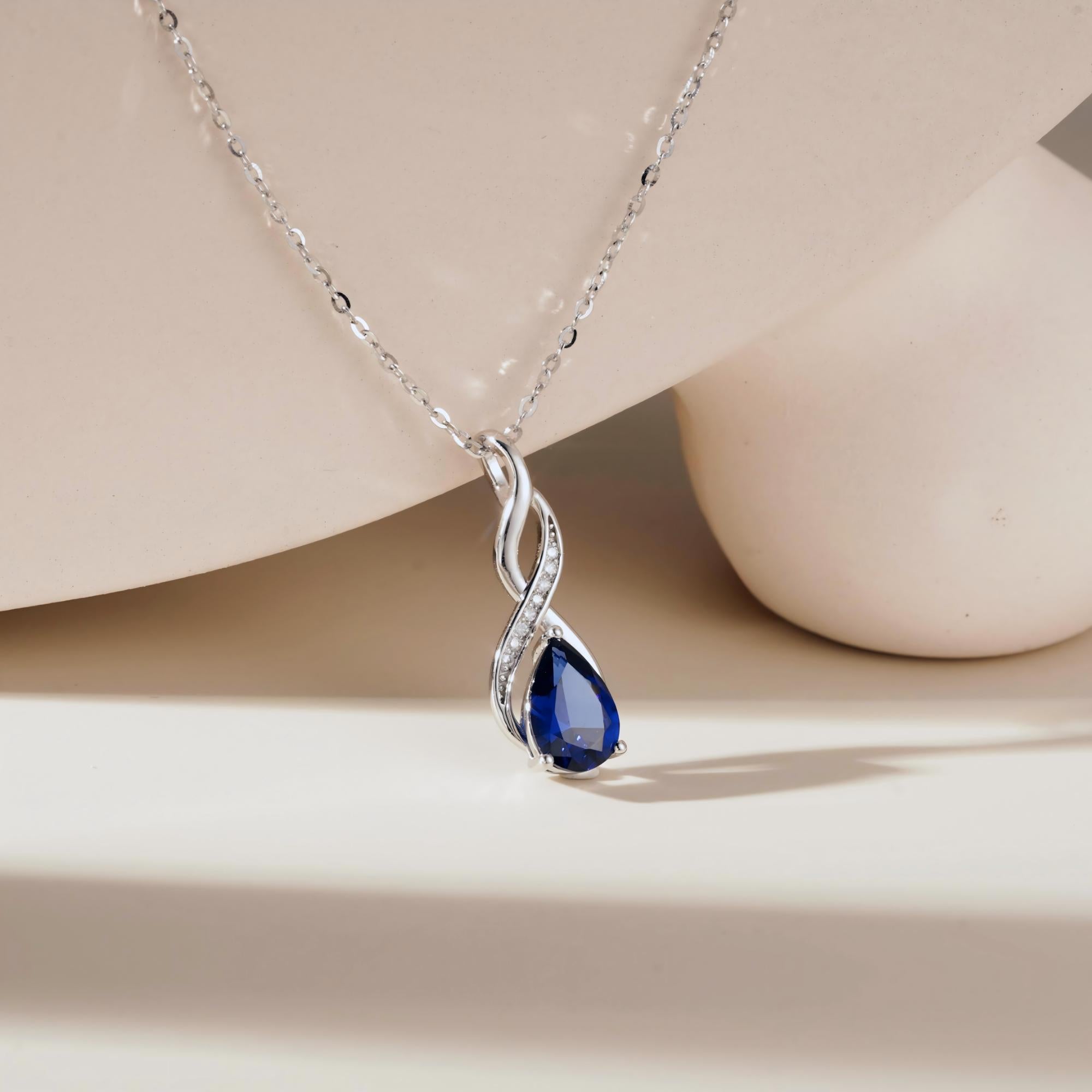 1.56 CT. Blue Sapphire and White Sapphire Infinity Swirl Pendant - MSBLUE Jewelry