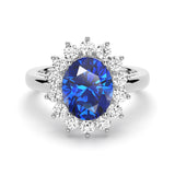 2 CT. Oval Sapphire Ring with Sunburst Diamond Halo