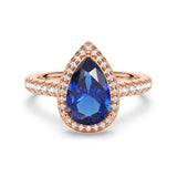 1.5 CT. Pear-Shaped Sapphire Ring with White Sapphire Halo Accents