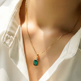 4 CT. Emerald-Cut Emerald Pendant With Trio Moissanite Diamonds