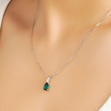 1.7 CT. Pear Shaped Emerald Solitaire Pendant with White Sapphire