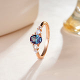 1.5 CT. Oval Alexandrite Engagement Ring With Moonstone Accents